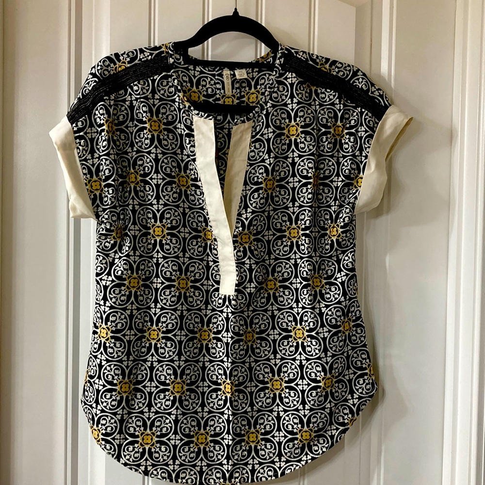 XS blouse with beaded detail on shoulder.